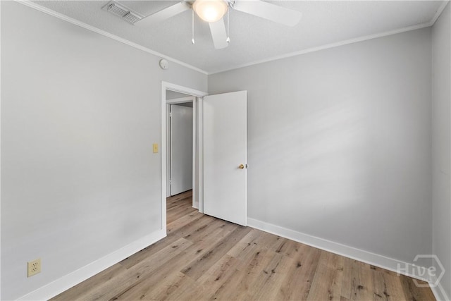 129 Vandiver Rd, Walthourville, GA 31301 - spare room with light wood-style flooring, ornamental molding, and a ceiling fan