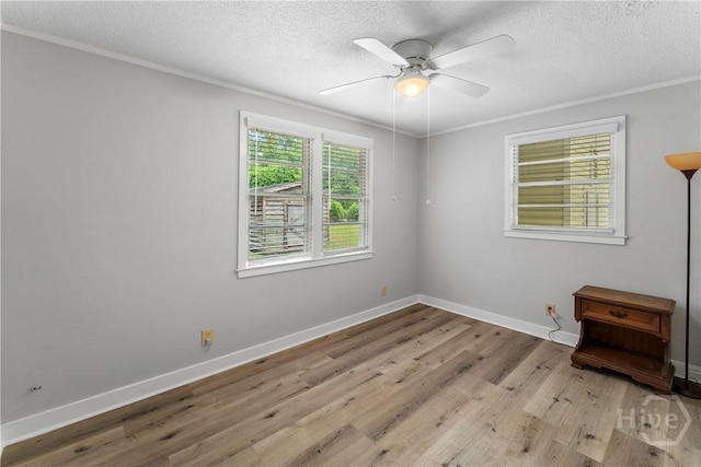 129 Vandiver Rd, Walthourville, GA 31301 - spare room featuring ornamental molding, a textured ceiling, ceiling fan, and wood finished floors