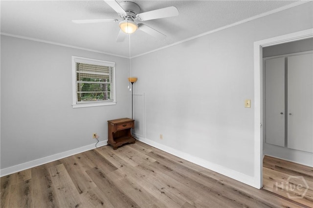 129 Vandiver Rd, Walthourville, GA 31301 - spare room featuring ornamental molding, wood finished floors, a ceiling fan, and a textured ceiling