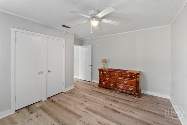 129 Vandiver Rd, Walthourville, GA 31301 - bedroom with wood finished floors, crown molding, a textured ceiling, and a ceiling fan