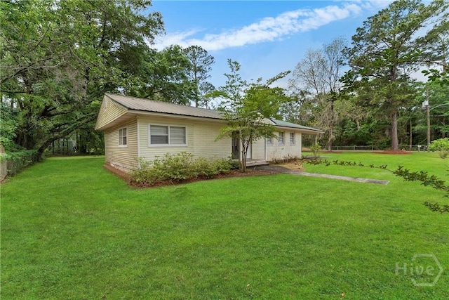 129 Vandiver Rd, Walthourville, GA 31301 - view of front of property with a front lawn