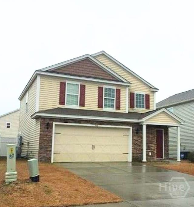 306 Connor Ct, Hinesville, GA 31313 - view of front of property with a garage and concrete driveway