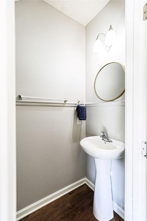 1125 Canyon Oak Loop, Richmond Hill, GA 31324 - bathroom featuring baseboards and wood finished floors