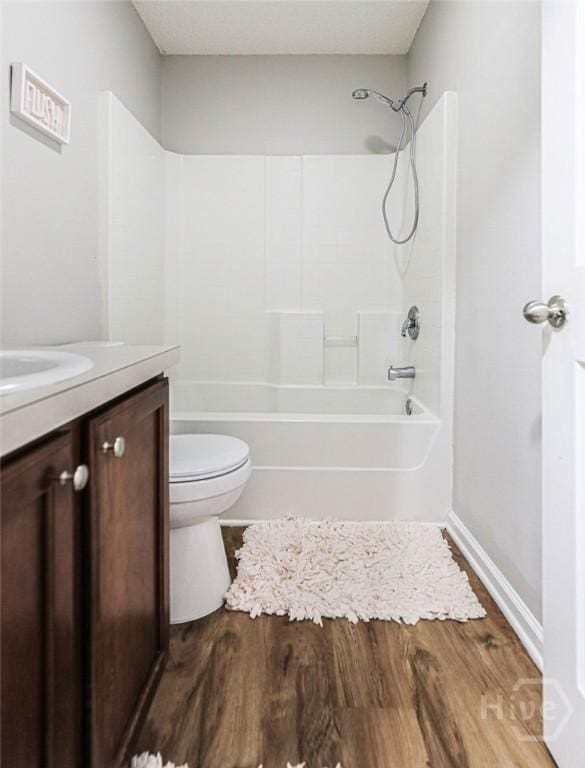 1125 Canyon Oak Loop, Richmond Hill, GA 31324 - bathroom with vanity, shower / tub combination, and wood finished floors