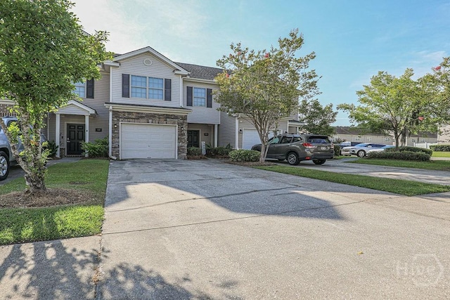 1125 Canyon Oak Loop, Richmond Hill, GA 31324 - townhome / multi-family property featuring stone siding, driveway, and a garage