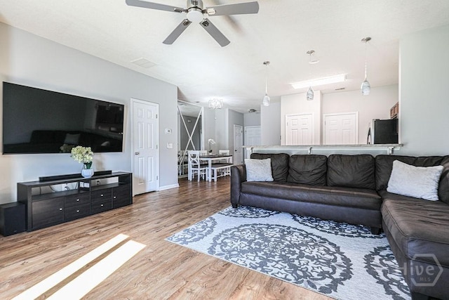 1125 Canyon Oak Loop, Richmond Hill, GA 31324 - living room featuring ceiling fan and wood finished floors