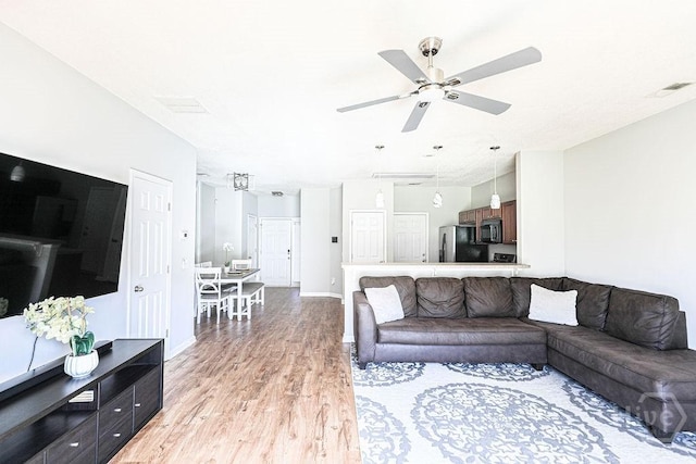 1125 Canyon Oak Loop, Richmond Hill, GA 31324 - living area featuring light wood finished floors and a ceiling fan