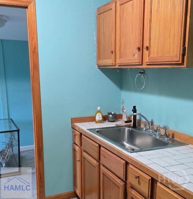 485 Lake Pamona Rd, Midway, GA 31320 - kitchen featuring a sink and tile counters