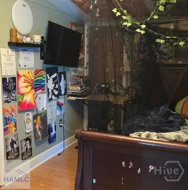 485 Lake Pamona Rd, Midway, GA 31320 - bedroom featuring wood finished floors and baseboards