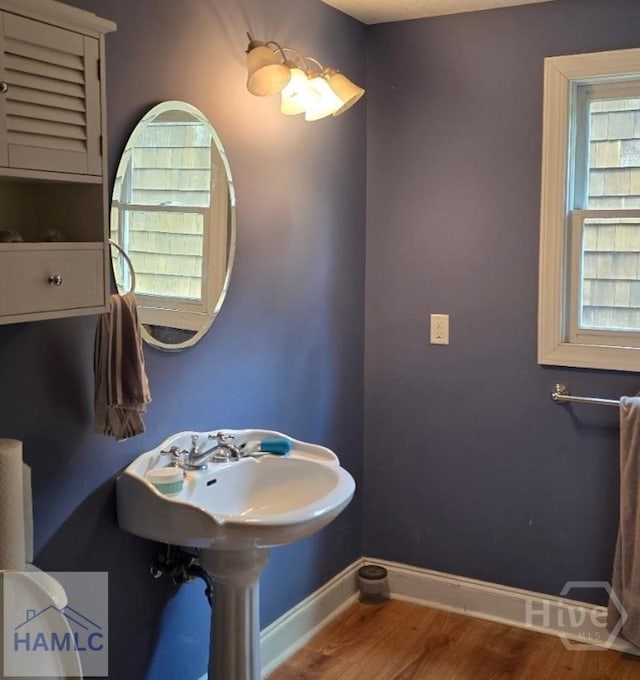 485 Lake Pamona Rd, Midway, GA 31320 - bathroom with baseboards and wood finished floors