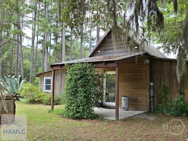 485 Lake Pamona Rd, Midway, GA 31320 - view of property exterior with a patio