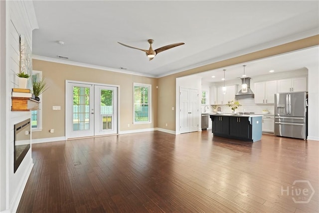 95 Simcoe Lake Dr, Richmond Hill, GA 31324 - unfurnished living room featuring a ceiling fan, dark wood-style flooring, and crown molding
