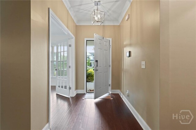 95 Simcoe Lake Dr, Richmond Hill, GA 31324 - entrance foyer featuring dark wood-style floors, a chandelier, and ornamental molding