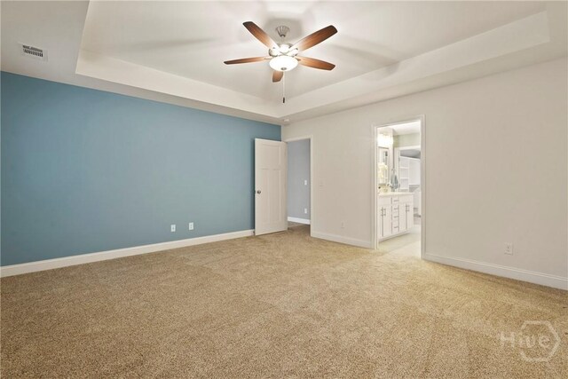 95 Simcoe Lake Dr, Richmond Hill, GA 31324 - unfurnished room featuring a raised ceiling, ceiling fan, and light colored carpet
