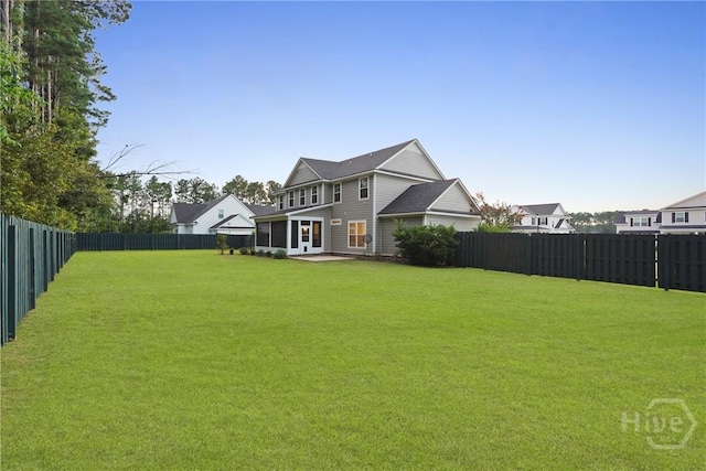 95 Simcoe Lake Dr, Richmond Hill, GA 31324 - back of property featuring a fenced backyard and a patio