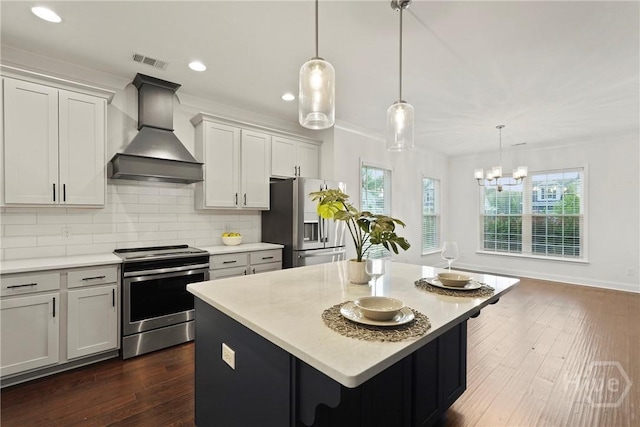 95 Simcoe Lake Dr, Richmond Hill, GA 31324 - kitchen featuring appliances with stainless steel finishes, custom exhaust hood, healthy amount of natural light, backsplash, and recessed lighting