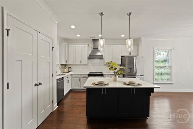 95 Simcoe Lake Dr, Richmond Hill, GA 31324 - kitchen with wall chimney exhaust hood, stainless steel appliances, ornamental molding, light countertops, and backsplash
