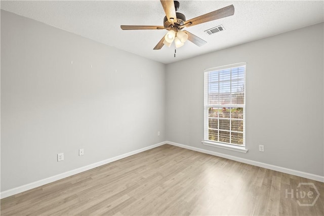 226 Cyane Ln, Guyton, GA 31312 - spare room with wood finished floors, ceiling fan, and a textured ceiling