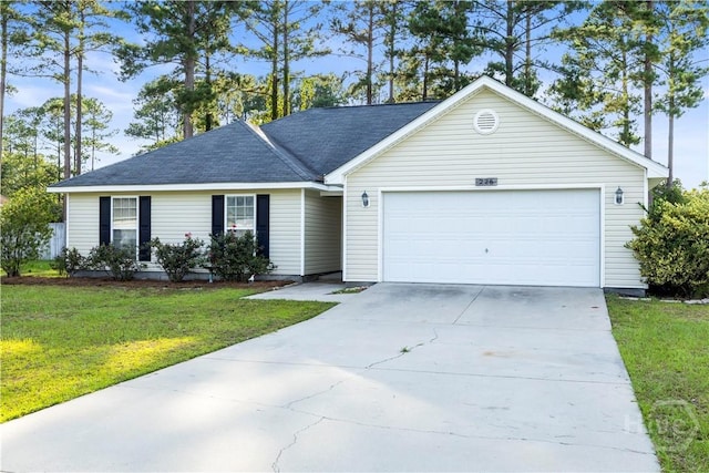 226 Cyane Ln, Guyton, GA 31312 - single story home with a garage, driveway, and a front yard
