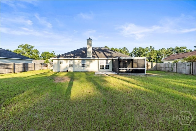 226 Cyane Ln, Guyton, GA 31312 - back of property featuring a sunroom, a fenced backyard, and a chimney