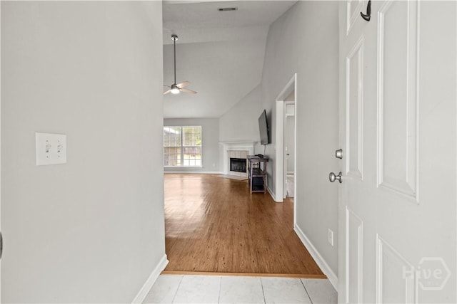 226 Cyane Ln, Guyton, GA 31312 - hallway with high vaulted ceiling and light tile patterned flooring