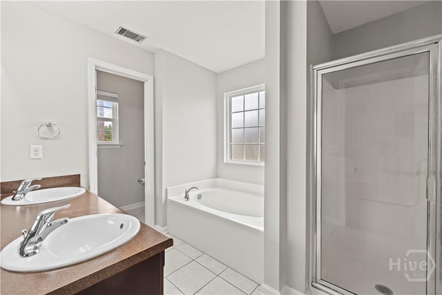 226 Cyane Ln, Guyton, GA 31312 - bathroom featuring a garden tub, a shower stall, double vanity, and tile patterned floors