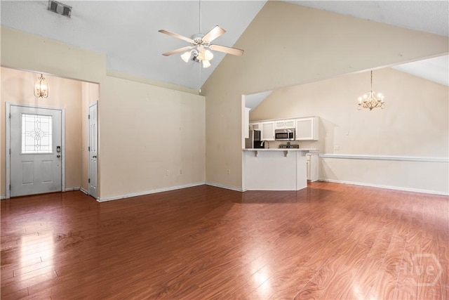 259 Laurel Hill Cir, Richmond Hill, GA 31324 - unfurnished living room featuring a chandelier, a ceiling fan, high vaulted ceiling, and wood finished floors