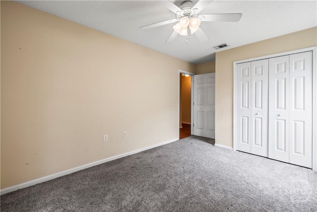 259 Laurel Hill Cir, Richmond Hill, GA 31324 - unfurnished bedroom featuring carpet, a closet, ceiling fan, and a textured ceiling