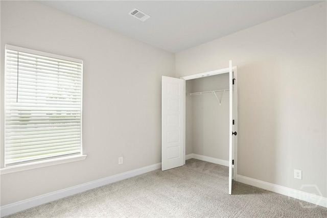 328 Providence Trce, Statesboro, GA 30461 - unfurnished bedroom with light colored carpet and a closet
