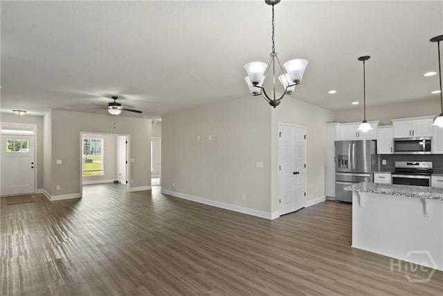 328 Providence Trce, Statesboro, GA 30461 - kitchen with appliances with stainless steel finishes, open floor plan, a breakfast bar area, dark wood-style floors, and recessed lighting