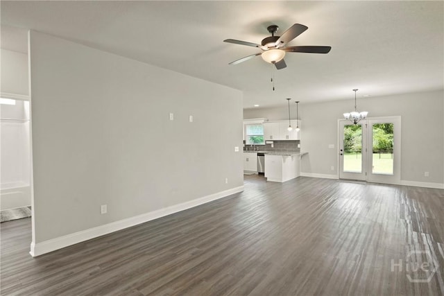 328 Providence Trce, Statesboro, GA 30461 - unfurnished living room with a ceiling fan, a chandelier, and dark wood-type flooring