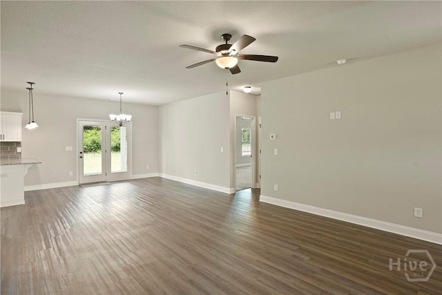 328 Providence Trce, Statesboro, GA 30461 - unfurnished living room with ceiling fan, dark wood-style flooring, and a chandelier
