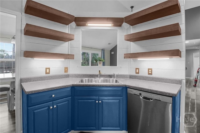 175 Salt Landing Cir, Savannah, GA 31405 - kitchen with open shelves, dishwasher, blue cabinets, vaulted ceiling, and wood finished floors
