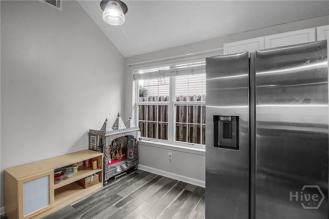 175 Salt Landing Cir, Savannah, GA 31405 - kitchen with stainless steel refrigerator with ice dispenser, vaulted ceiling, wood finished floors, and white cabinetry
