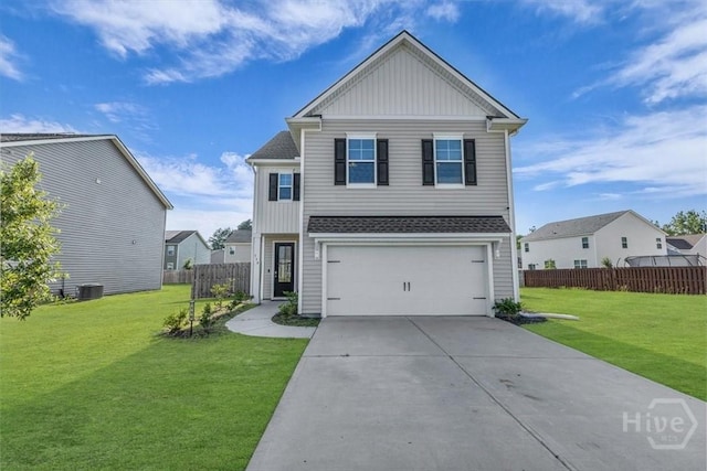 338 Wedge Cir, Richmond Hill, GA 31324 - view of front facade with board and batten siding, an attached garage, and driveway