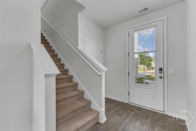 338 Wedge Cir, Richmond Hill, GA 31324 - foyer entrance featuring stairs and wood finished floors