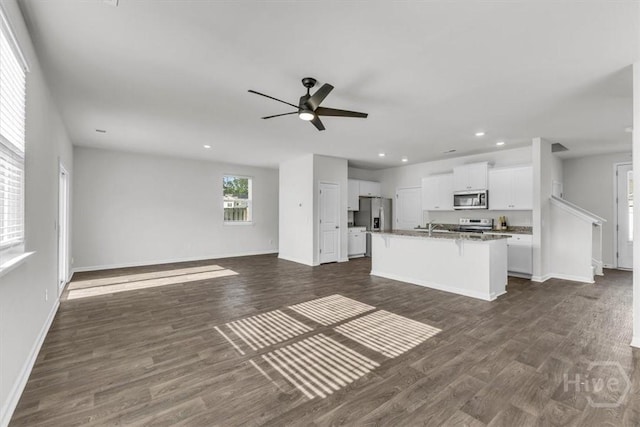 338 Wedge Cir, Richmond Hill, GA 31324 - kitchen with stainless steel appliances, open floor plan, recessed lighting, white cabinetry, and dark wood-style floors