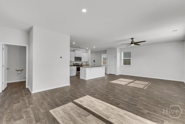 338 Wedge Cir, Richmond Hill, GA 31324 - unfurnished living room featuring a ceiling fan, dark wood-type flooring, and recessed lighting