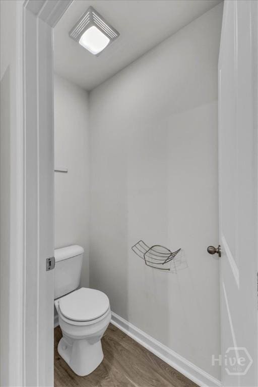 338 Wedge Cir, Richmond Hill, GA 31324 - bathroom with toilet and wood finished floors
