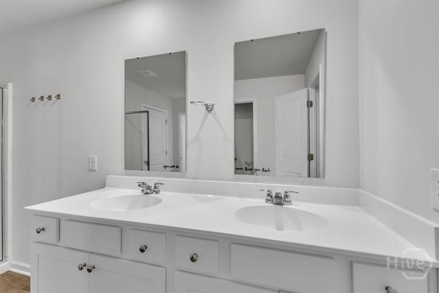 338 Wedge Cir, Richmond Hill, GA 31324 - full bathroom featuring double vanity and a shower with door