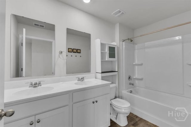 338 Wedge Cir, Richmond Hill, GA 31324 - full bathroom with double vanity, wood finished floors, and  shower combination