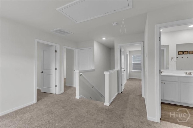 338 Wedge Cir, Richmond Hill, GA 31324 - hallway featuring attic access, carpet flooring, an upstairs landing, and recessed lighting