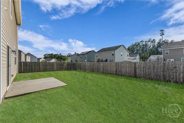 338 Wedge Cir, Richmond Hill, GA 31324 - fenced backyard with a residential view and a patio