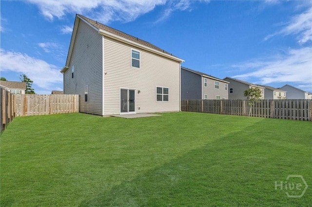 338 Wedge Cir, Richmond Hill, GA 31324 - rear view of house with a fenced backyard and a patio