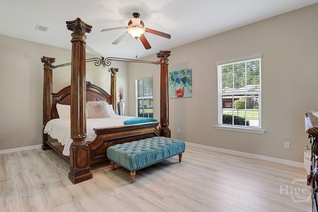 208 Chippingwood Cir, Pooler, GA 31322 - bedroom with light wood-style flooring, multiple windows, and a ceiling fan