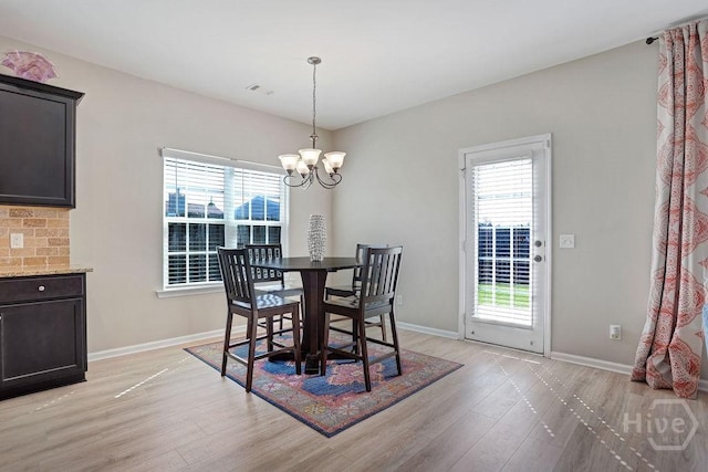 208 Chippingwood Cir, Pooler, GA 31322 - dining space featuring light wood-style floors, plenty of natural light, and a chandelier