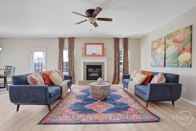 208 Chippingwood Cir, Pooler, GA 31322 - living room featuring wood finished floors, ceiling fan, and a fireplace
