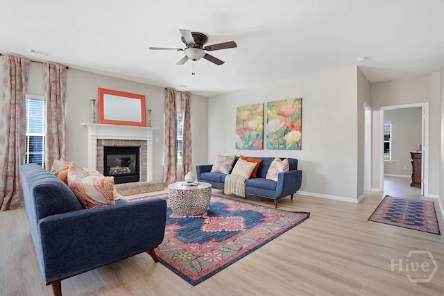 208 Chippingwood Cir, Pooler, GA 31322 - living area with ceiling fan, light wood-style floors, and a fireplace