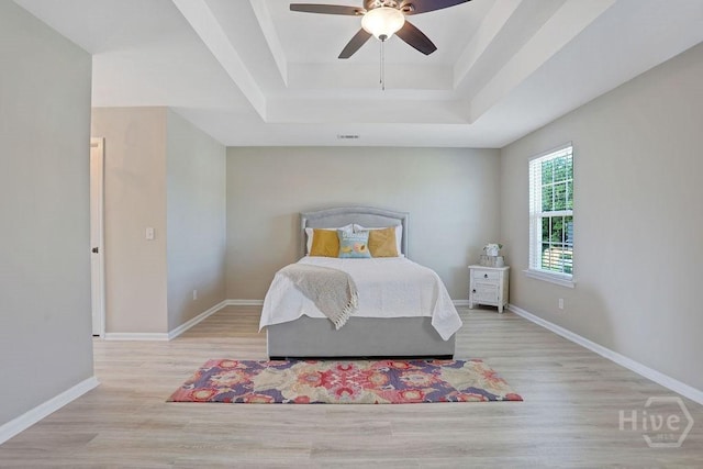 208 Chippingwood Cir, Pooler, GA 31322 - bedroom with a raised ceiling, wood finished floors, and ceiling fan