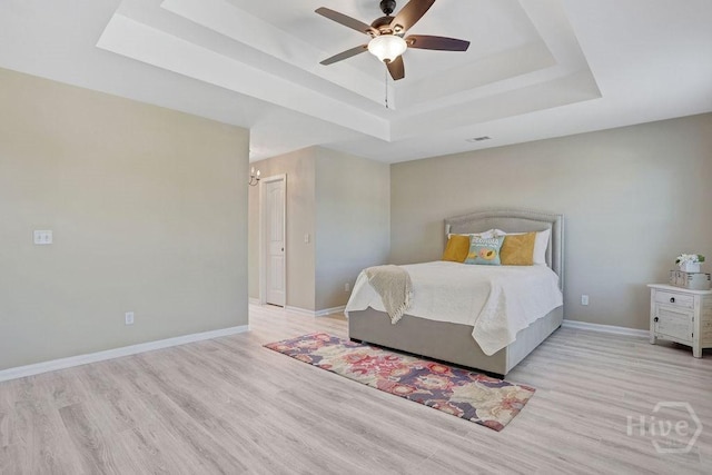 208 Chippingwood Cir, Pooler, GA 31322 - bedroom with a tray ceiling, wood finished floors, and ceiling fan